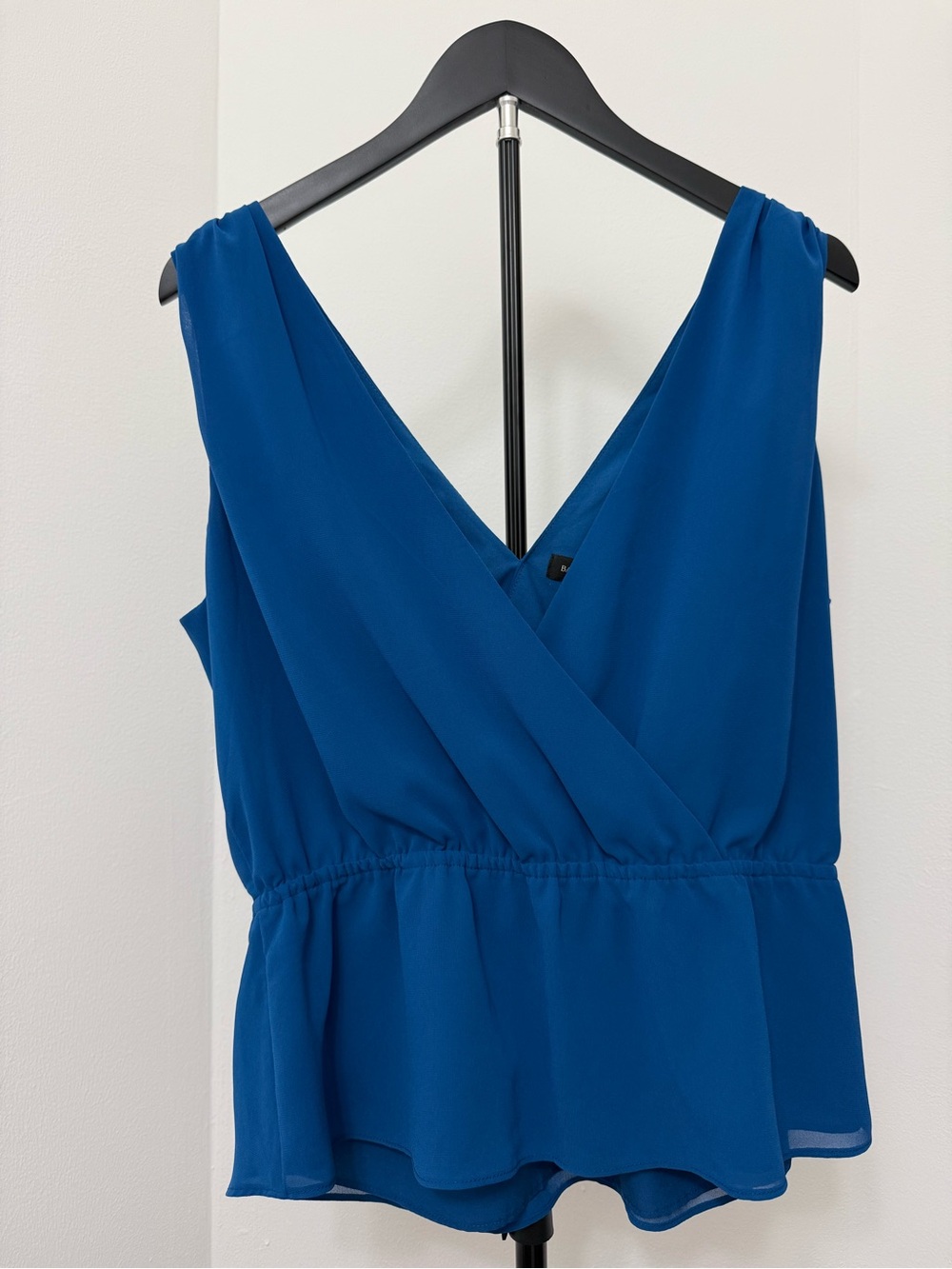 Blue Sleeveless V-Neck Peplum Top